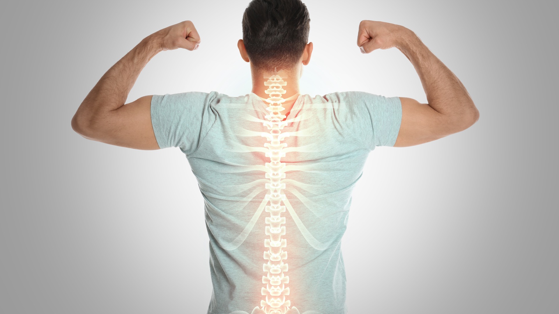 Man with healthy back on light background. Spine pain prevention